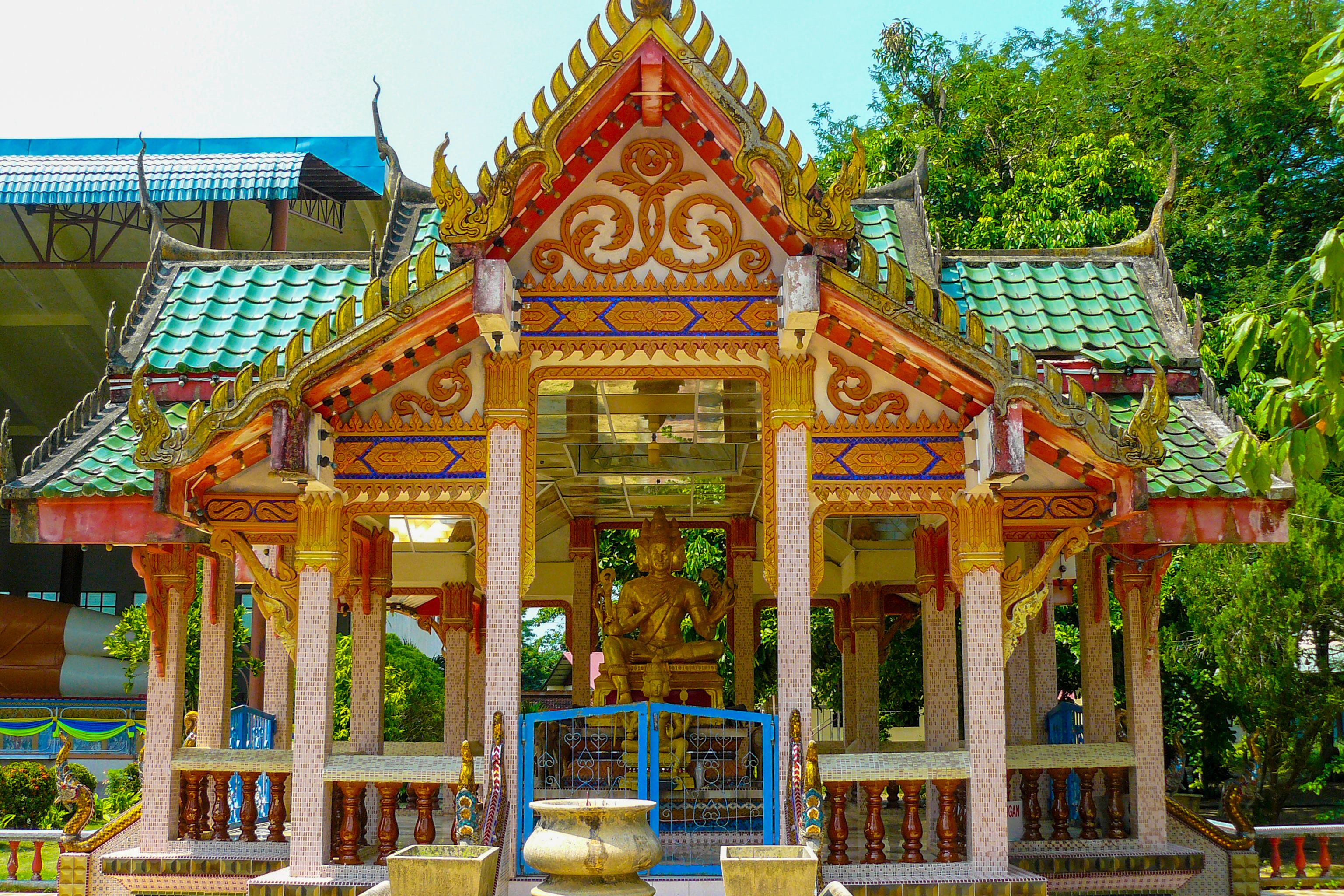 god Brahma statue with four faces of the creator in temple of  Wat Photivihan  Malaysia