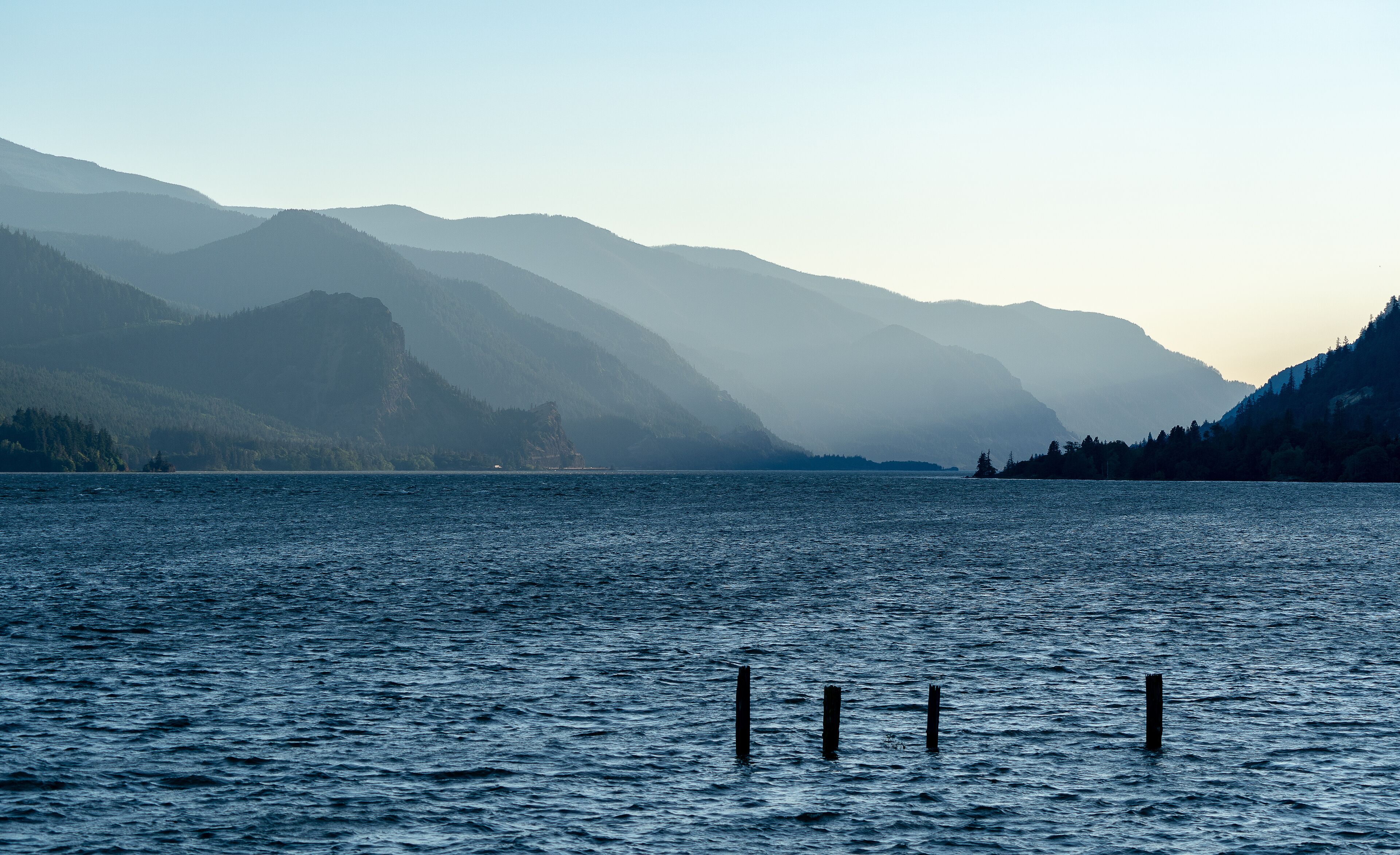 Mountain range illuminated in layers by the slanting rays of the western evening sun in the Columbia River Gorge