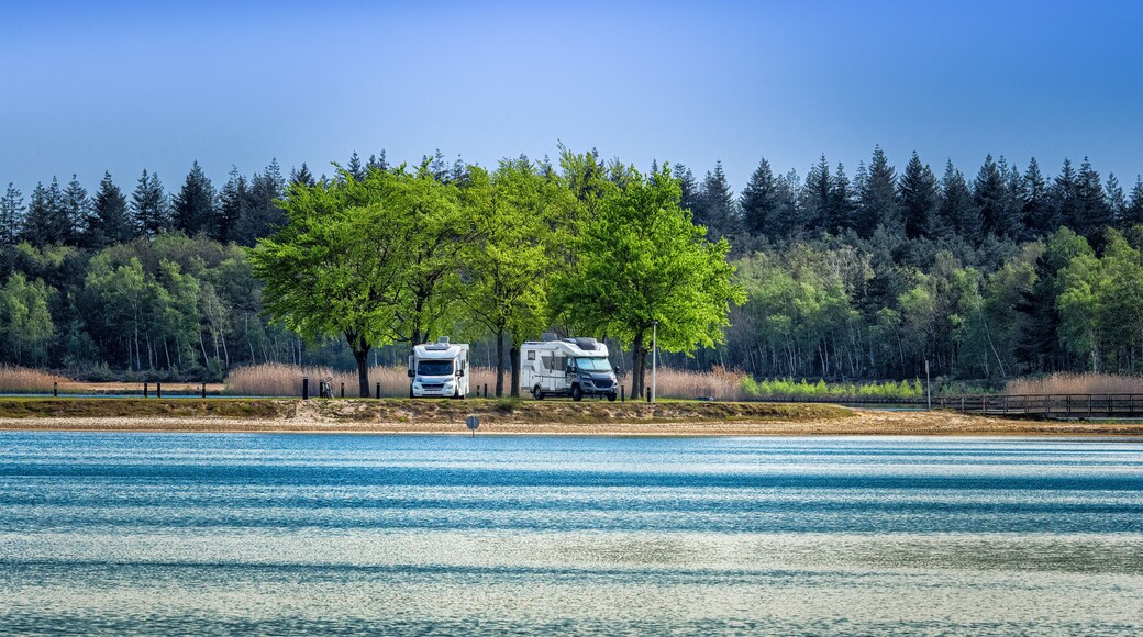 Camper vans parked near lake in Eersel, Netherlands
