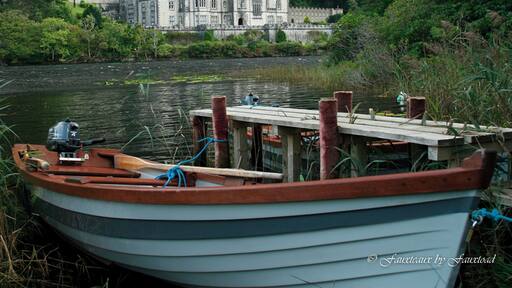 Kylemore Abbey as seen from the boat dock across Lough Pollocappul, Connemara County, Ireland. Technically not a real abbey anymore. This was built as a Benedictine monastery and has now been converted to a private girls school.