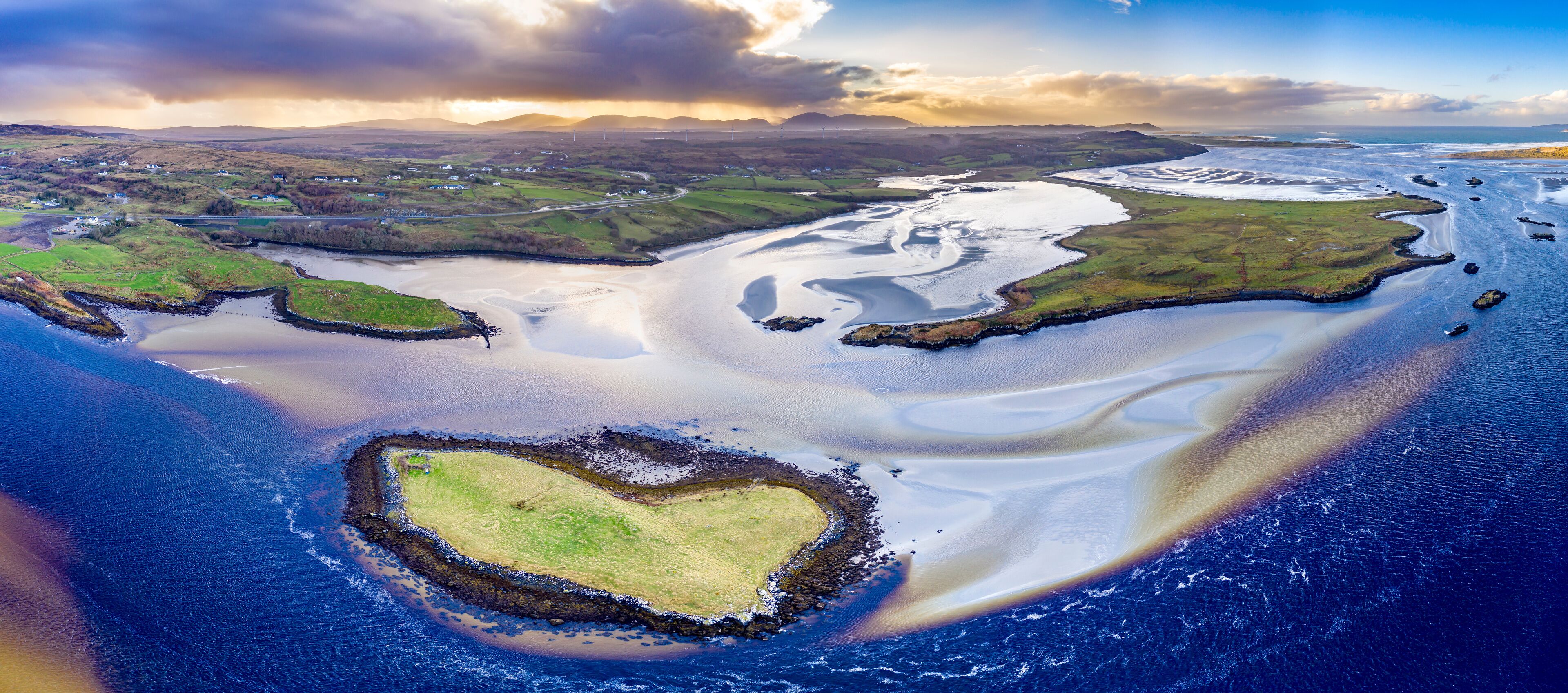 The heart shaped island at the coast between Lettermacaward and Portnoo in County Donegal - Ireland.