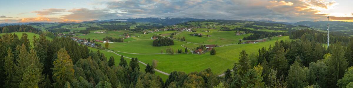 panoramic aerial photo near sunset in the Allgäu Alps next to village of Oberreute, Bavaria, Germany