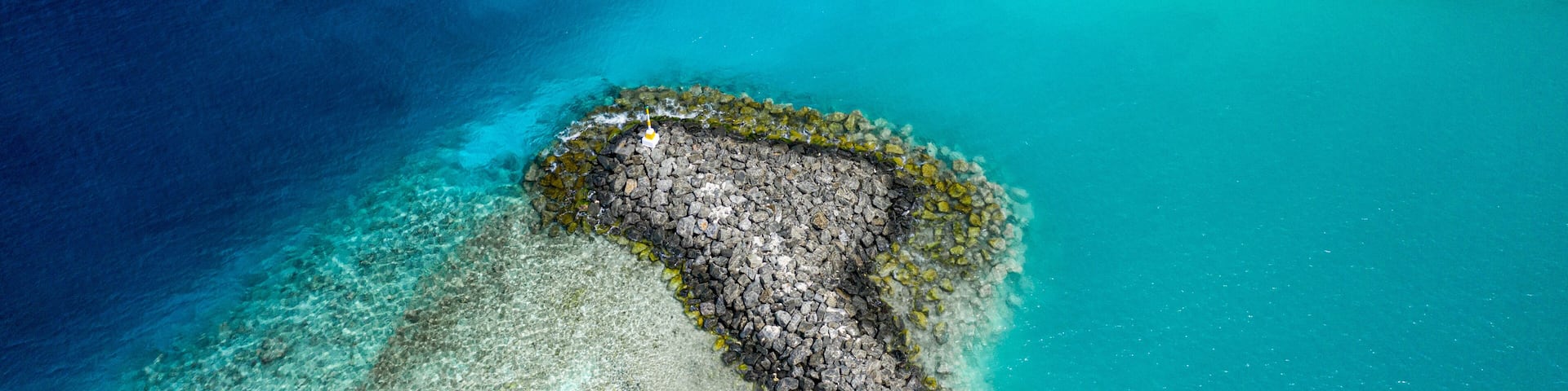 Aerial view of harbour entry of Keyodhoo, Vaavu Atoll, Maldives, Indian Ocean with speedboat coming in