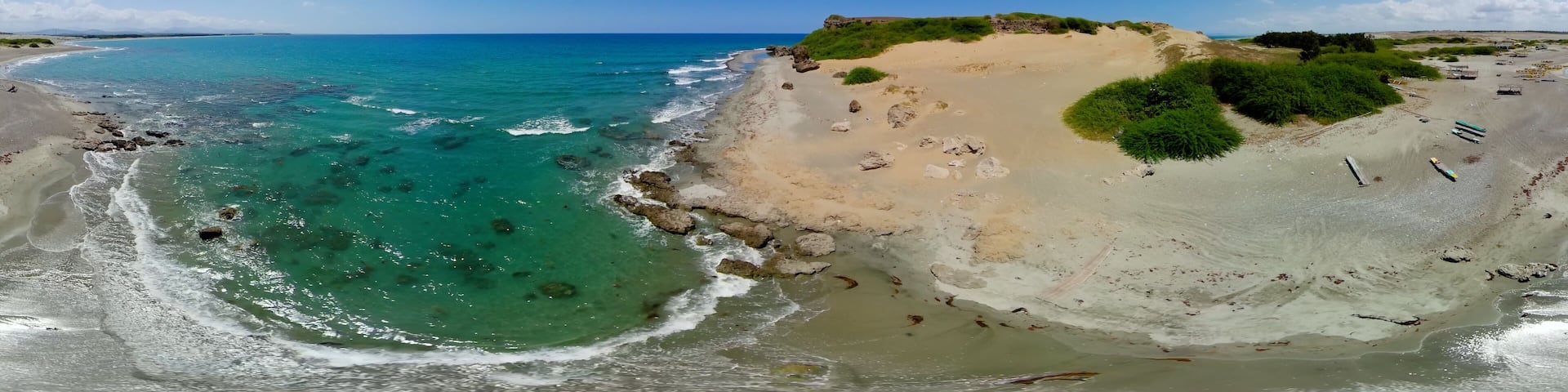Beach with fishing boats and blue sea. Paoay Sand Dunes, Ilocos Norte, Philippines. VR 360.