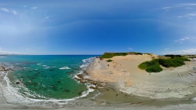 Beach with fishing boats and blue sea. Paoay Sand Dunes, Ilocos Norte, Philippines. VR 360.