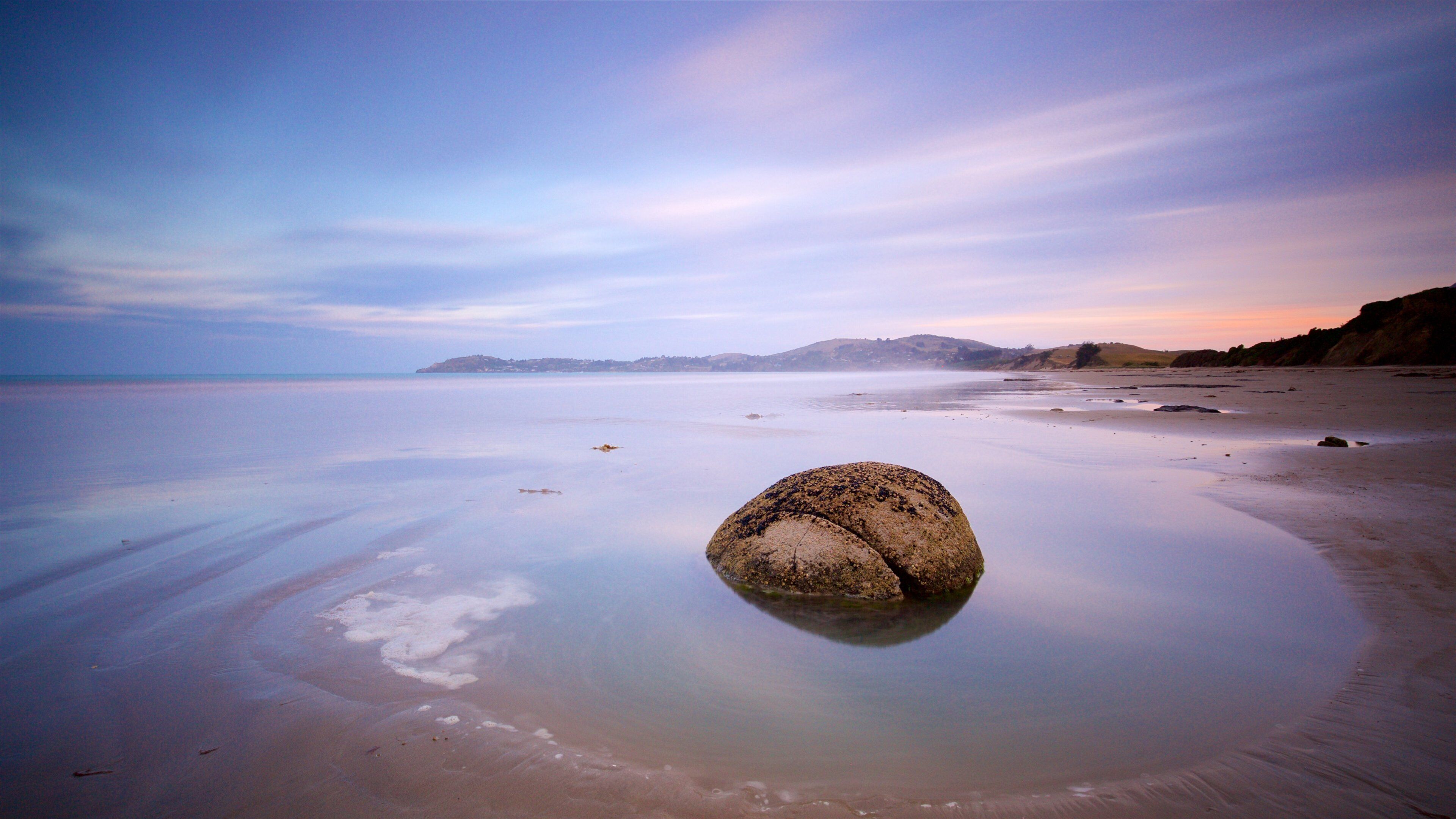 Hampden showing a sunset and a lake or waterhole
