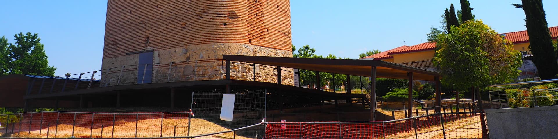Brick tower of the Castle of Arroyomolinos, in Madrid, Spain, with cannonball impacts