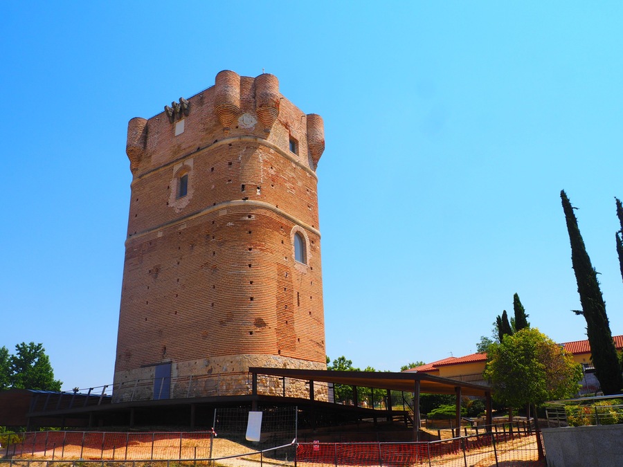 Brick tower of the Castle of Arroyomolinos, in Madrid, Spain, with cannonball impacts