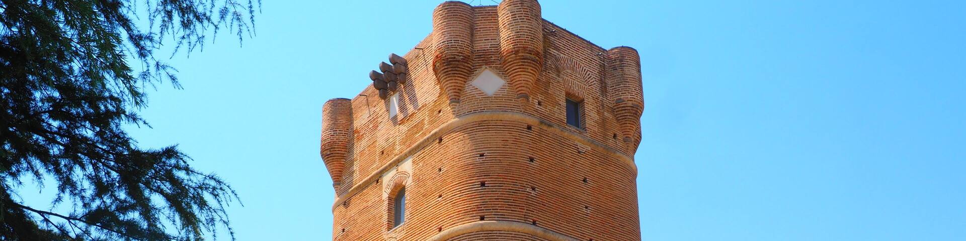 Brick tower of the Castle of Arroyomolinos, in Madrid, Spain, with cannonball impacts