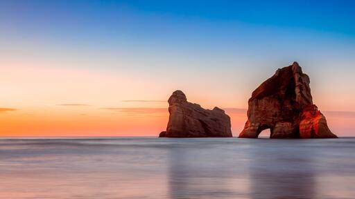 This is Wharariki Beach at sunset.
On the South Island of New Zealand we drove to the Northern tip at Farewell Point where Capt. James Cook said farewell to these islands on his way to Australia. This beach is just amazing, with little seal pups playing in the rock pools at low tide and these amazing rocks offshore. Best time to photograph these rocks is when the tide is going out and along the beach to the West. Only a short 1km walk from the car park. #OnTheRoad