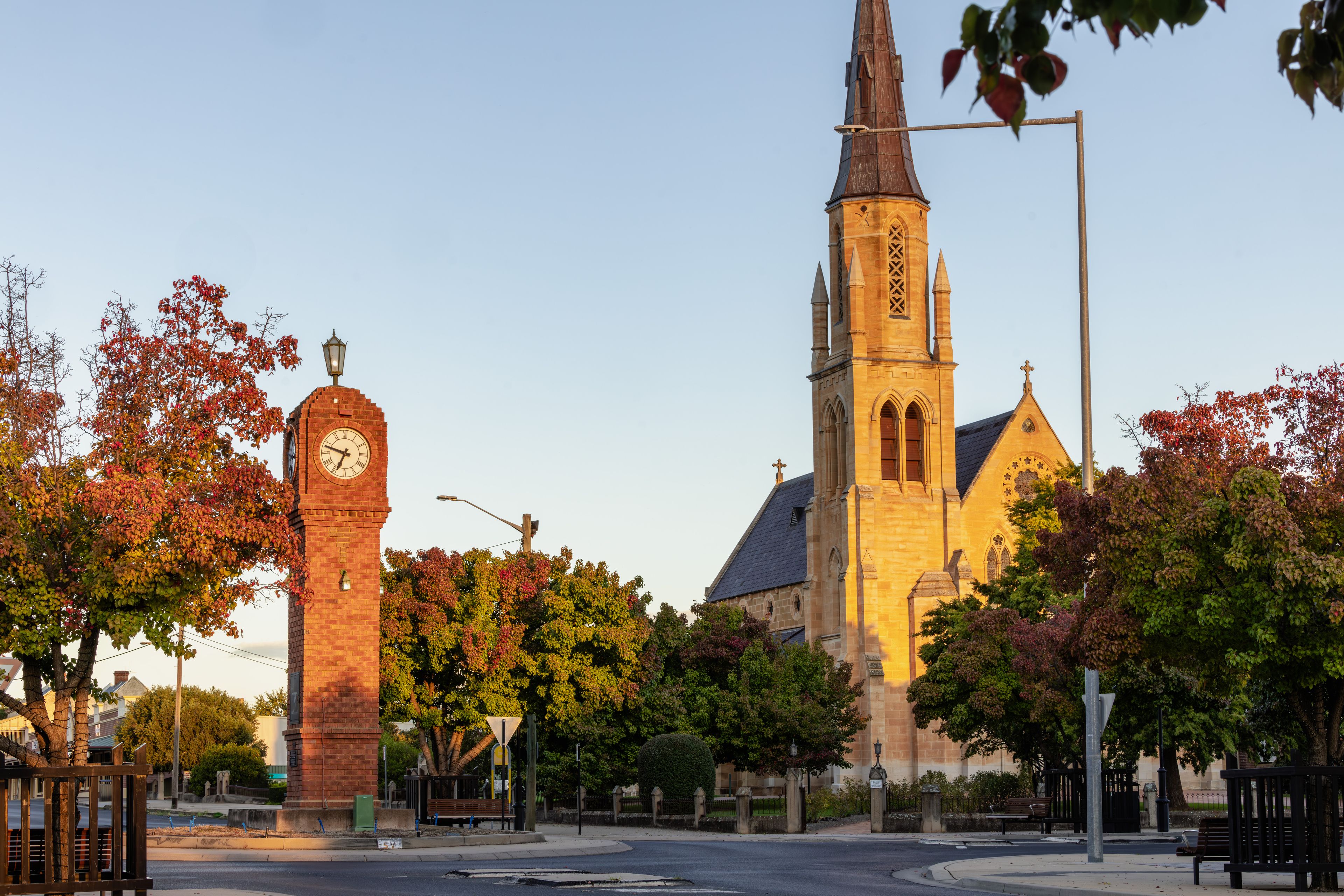 A church with a tall steeple and a clock tower.