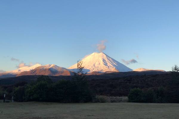 A snow-capped mountain with a clear sky.