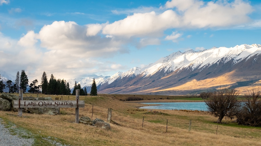 Ohau which includes mountains, signage and a lake or waterhole