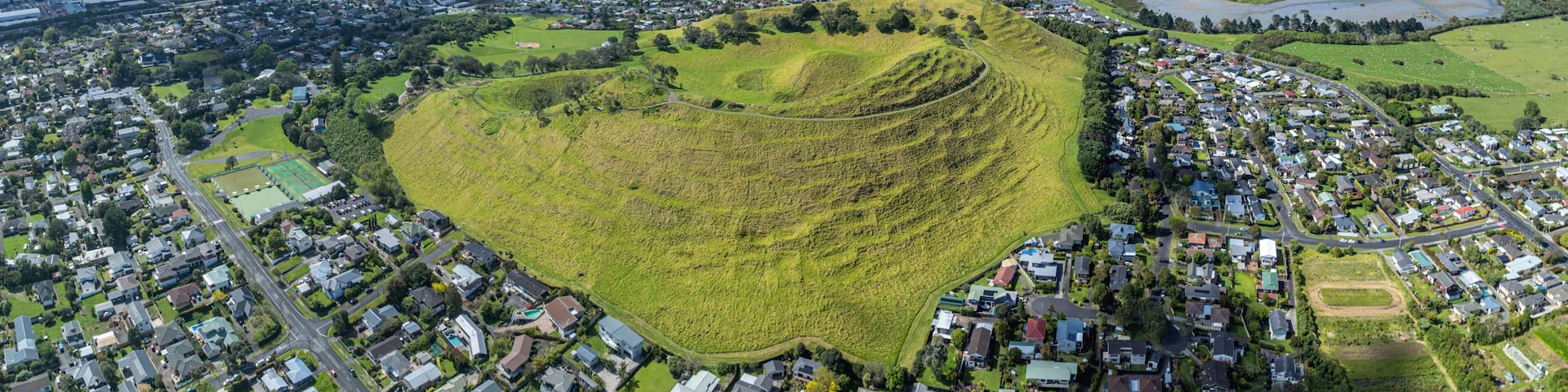 Aerial view of Mangere Mountain in the suburb of Mangere Bridge, Auckland, New Zealand