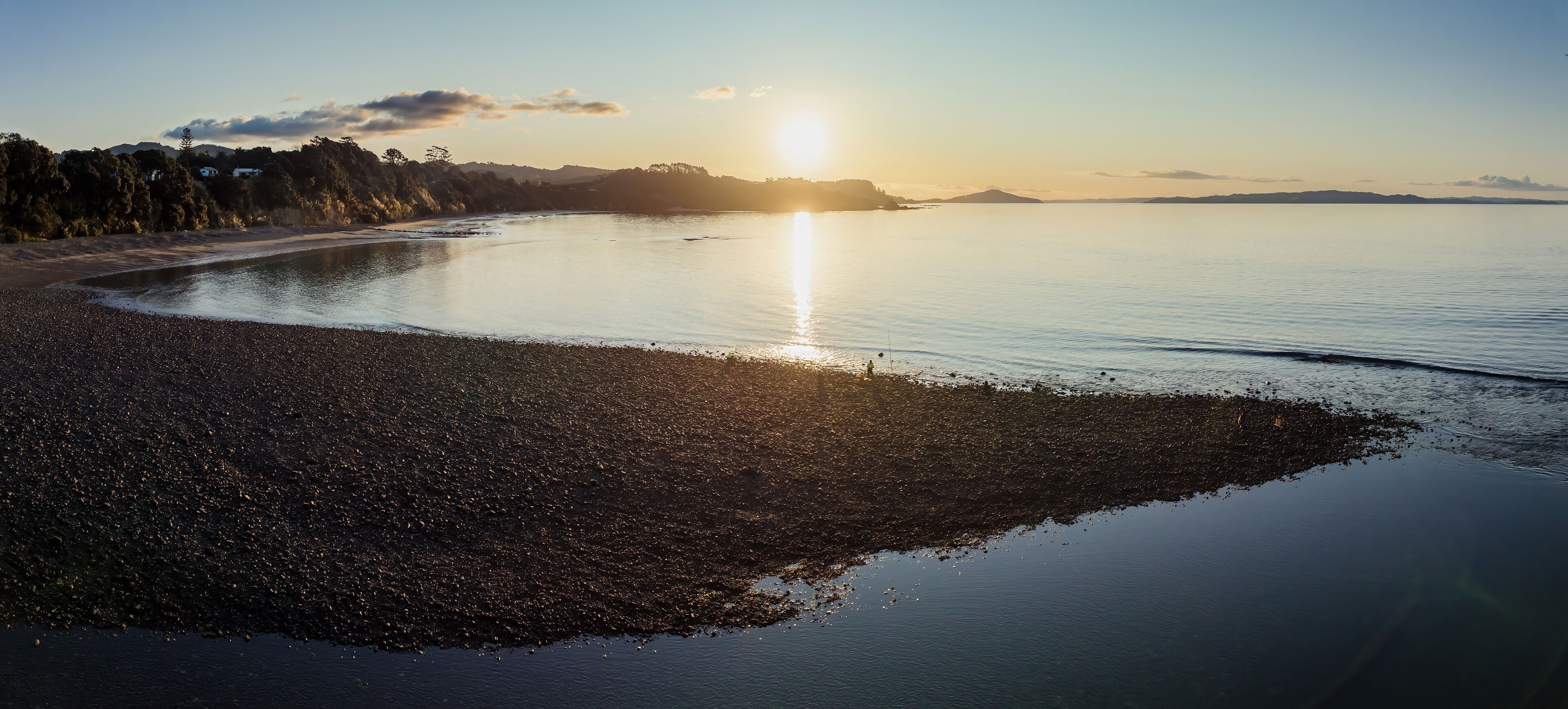 Shoreline of the Firth of Thames at sunset at Orere Point, Auckland, New Zealand.