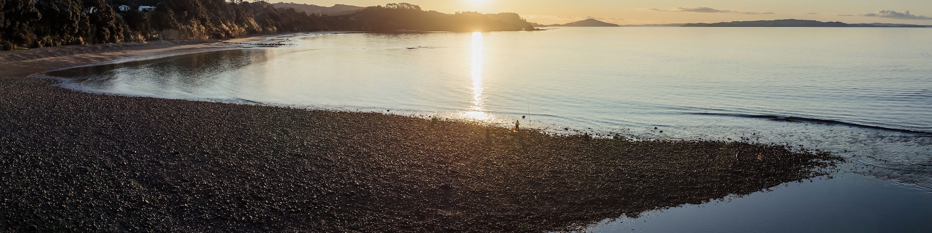 Shoreline of the Firth of Thames at sunset at Orere Point, Auckland, New Zealand.