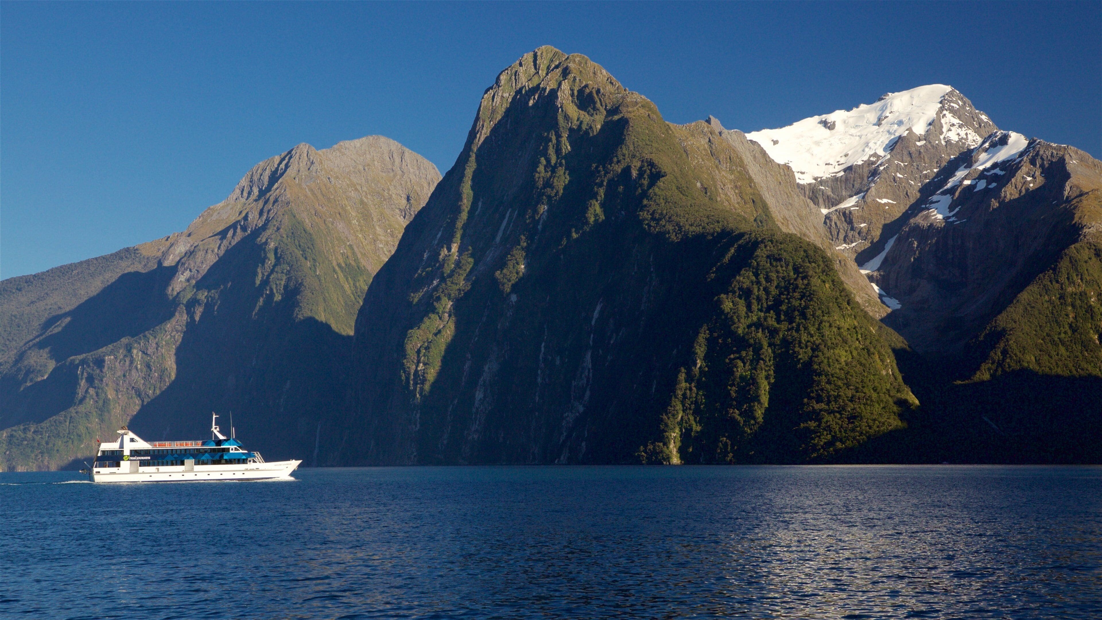 Fiordland National Park which includes boating, a bay or harbor and mountains