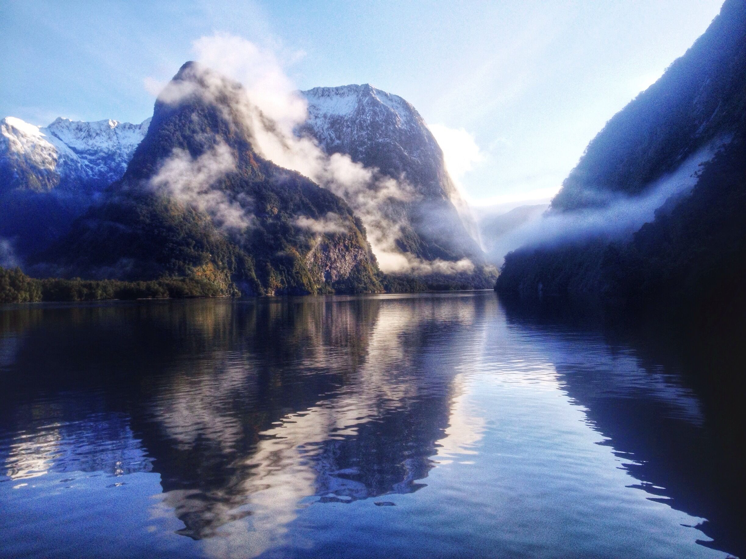 Over night cruise on Doubtful Sound - the water was like glass and the clouds were hugging all the surrounding mountains. Such a beautiful place. 