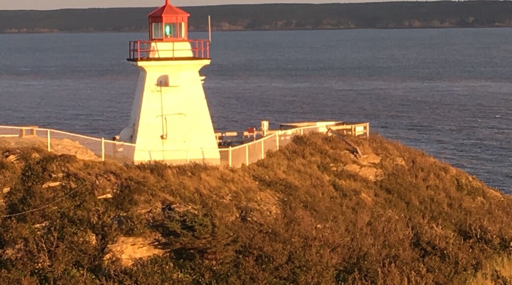 Awesome sunset over Cape Enrage Lighthouse while spending time at the beach, hiking, and dining.