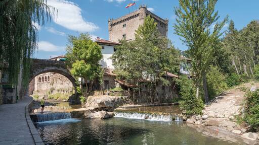 Old building near the bridge over the river in Potes, Cantabria, Spain