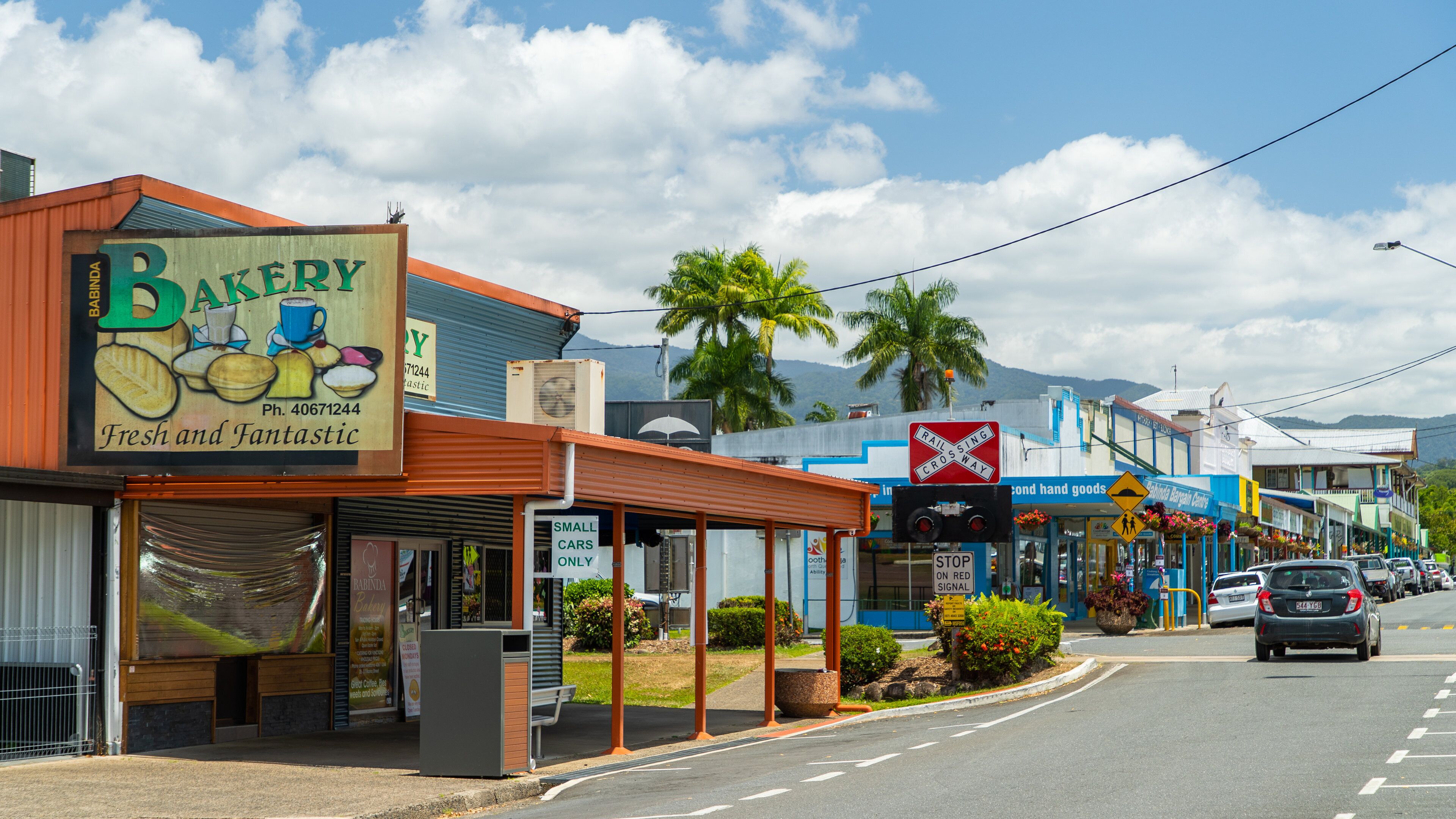 Babinda featuring signage and a small town or village