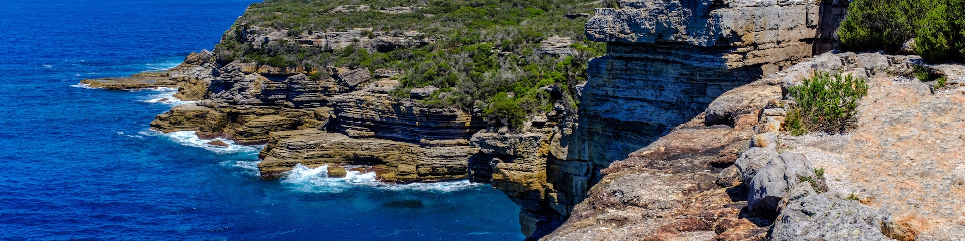 Panoramic coastal sea view and cliffs at Beecroft Head, Abrahams Bosom Reserve, Jervis Bay, NSW, Australia
