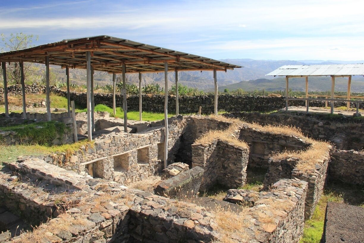 20km north east of Ayacucho, on the road to Quinua (not sure if the position on the map is EXACTLY correct) are the ruins of the capital of the Wari empire.  

The Wari ruled from 600AD to 1100AD and therefore pre-date the Incas.

The extensive ruins are scattered among endless fields of Opuntia cacti and Prickly Pear, and these were more of a fascination to me than the ruins themselves.  

Despite being so exposed, the site felt quite mysterious and strangely eerie: we didn't see a single other tourist there, but we did see swarms of locusts (which, at first we mistook for birds).

It's a beautiful spot, the views are amazing on a clear day and you'll see plenty of colourful butterflies and flowers.  But remember to bring water, as the site is literally in the middle of nowhere, so there are no opportunities to purchase any nearby.

You can catch a local bus, combi or shared taxi to the ruins, but be wary of stopping too late.  We stayed until dusk, and ended up having to hitch a ride back to Ayacucho because - I assume - we'd missed the last lot of public transportation heading that way.



