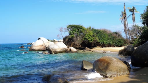 One of the beautiful beaches of Tayrona National Park in Colombia. You can hike from the National Park entrance to the beaches and stay overnight in a hammock.