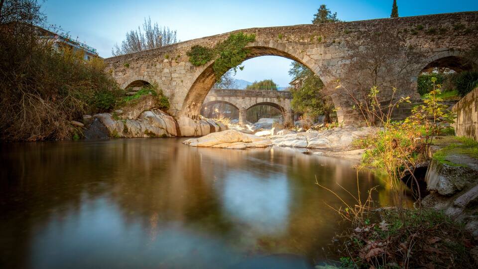 View of the medieval Aquelcabos bridge over the Arenal river in Arenas de San Pedro, Avila, Castilla y Leon, Spain, in the afternoon