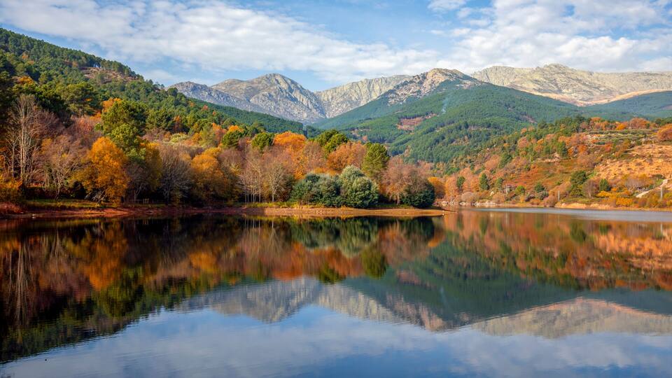 Beautiful autumn view of the Sierra de Gredos from the Riocuevas reservoir in Arenas de San Pedro, Avila, Castile and Leon, Spain