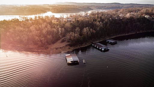 Bass fishermen fishing around dock on table rock lake during the winter