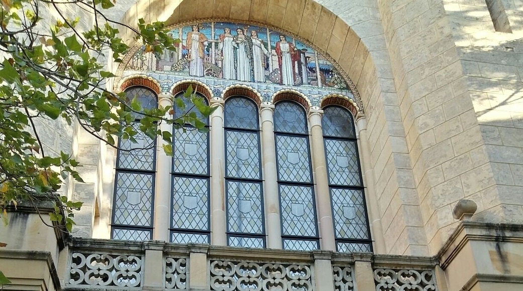 A very European archway at the University of Western Australia, with very Australian bushes beyond!