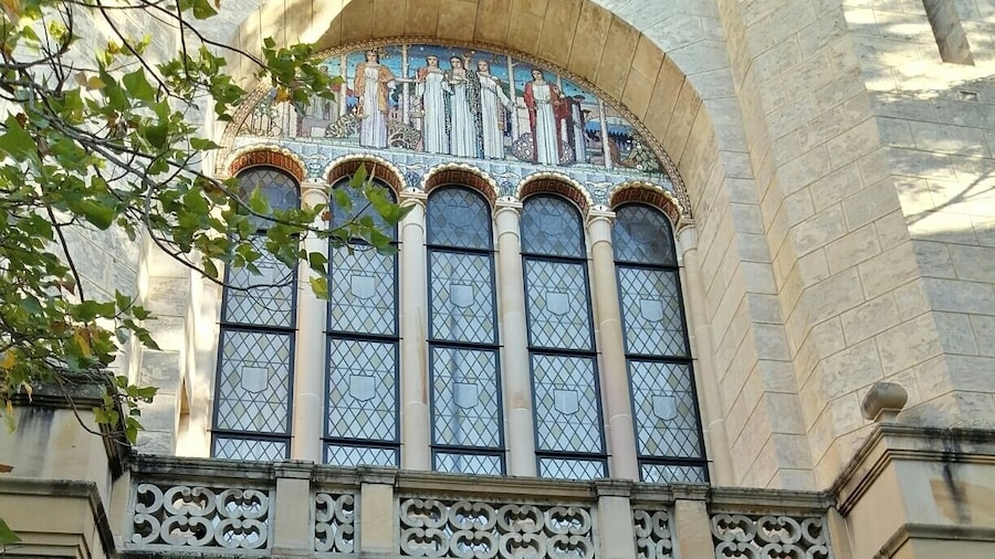 A very European archway at the University of Western Australia, with very Australian bushes beyond!