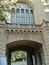 A very European archway at the University of Western Australia, with very Australian bushes beyond!