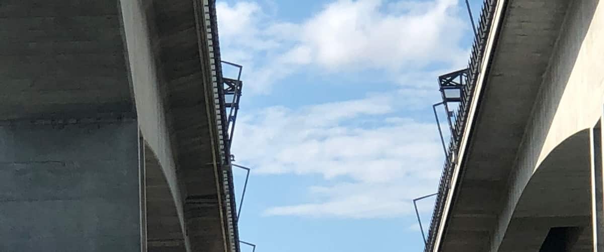 Commonly known as the Gateway Bridges.
Sir Leo Hielscher Bridges
Concrete cantilever box girder
Total length 1,627 metres (5,338 ft)
Width 22 metres (72 ft)
Height	64.5 metres (212 ft) above river level
Longest span	260 metres (850 ft)
Clearance below	59.2 m (194.2 ft) at mid-span