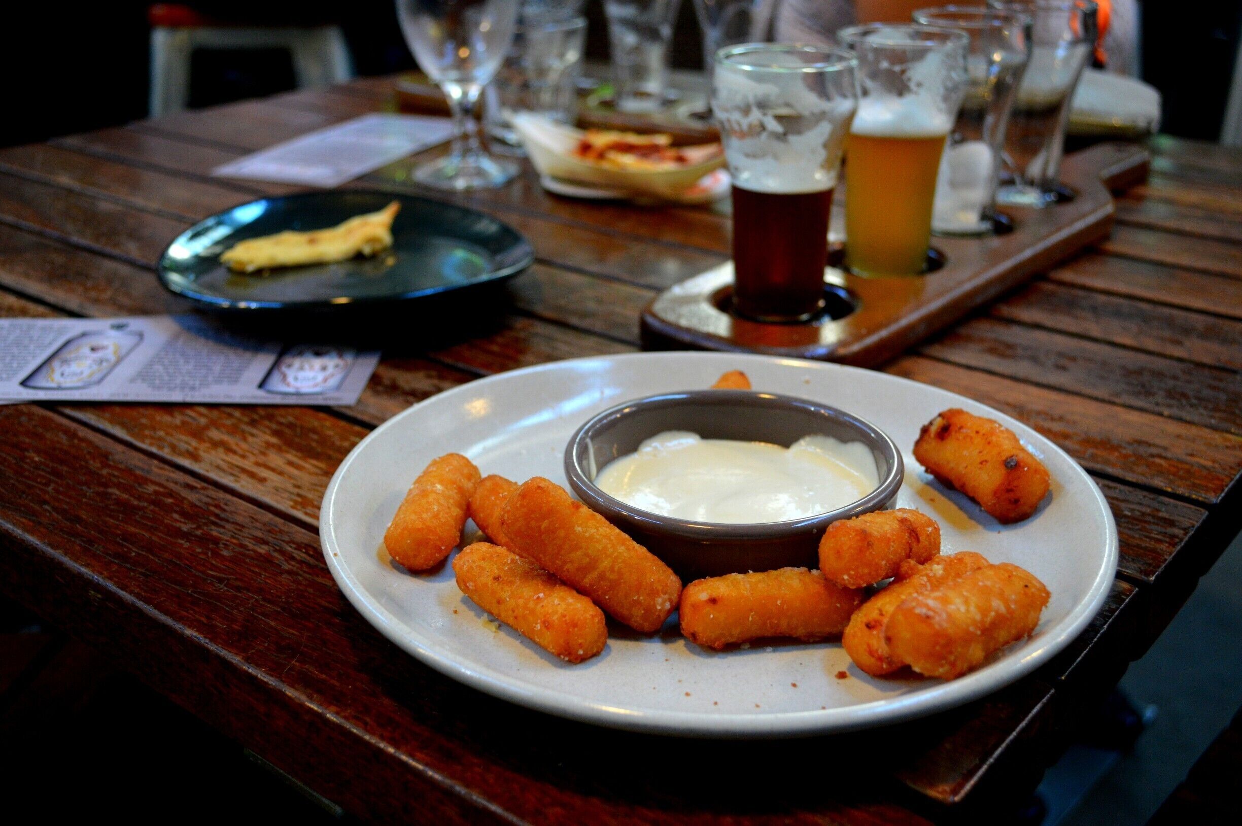 If you have ever been to Melbourne you will understand where I am coming from when I say that this place is up there with any of Melbourne’s funky Industrial style bars.  Its hip, sheik and down-right awesome.
Holding just 50 people, it also makes it an intimate setting for any function.
The Central Coast’s very own handcrafted Brewery was established in 2012 and officially opened in 2013.  They are always researching and creating new flavours of beers but have 5 core beers all year round.  All beers are free from any additives and preservatives.  They also offer homemade style lemonade called ‘Mother Goose Lemonade’ made onsite and a refreshing cider.  Grab a paddle and try their 4 taster beers and once you have picked a favourite you can take a one litre Squealer or two litre Growler home with you.  
With an uber-cool restaurant, I could not go past the cheese sticks, garlic bread pizza and the nachos, all accompanying the beer and drinks perfectly.  Live bands are extremely popular and they now have small group tours.
(Head to my blog to find out more...)