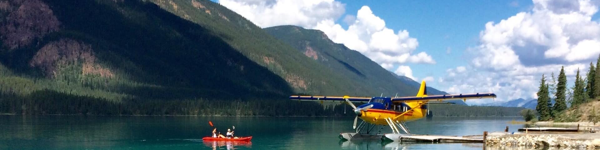 That's Debbie and me paddling around clear green Muncho Lake... Planes take off and land right from the water...
