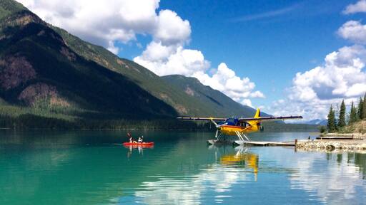 That's Debbie and me paddling around clear green Muncho Lake... Planes take off and land right from the water...