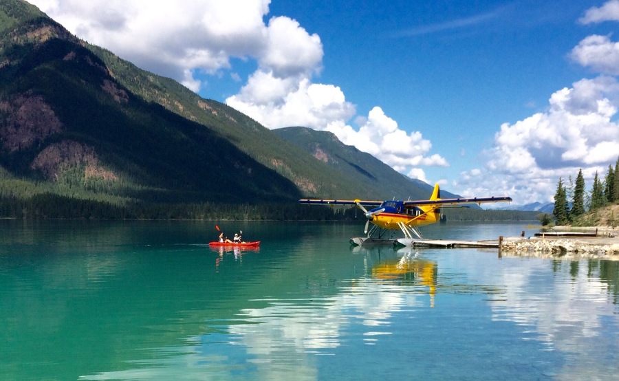 That's Debbie and me paddling around clear green Muncho Lake... Planes take off and land right from the water...