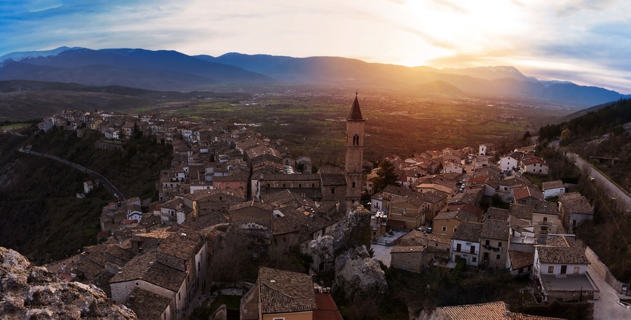 Small village on the valley at sunset (Pacentro - Italy)