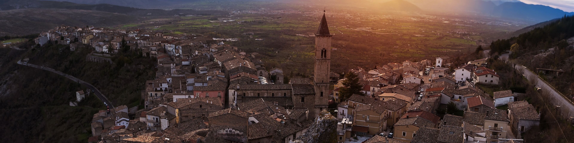 Small village on the valley at sunset (Pacentro - Italy)
