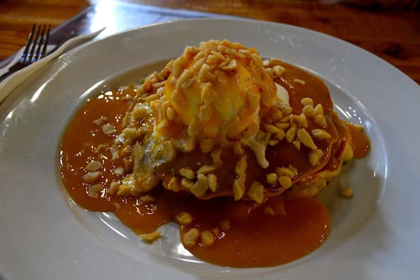 Mmmmm Pancakes! Short fluffy stack with Macadamia ice cream, mango sauce and fresh macadamia nuts on top.
A must stop if your in the Byron Bay Region.