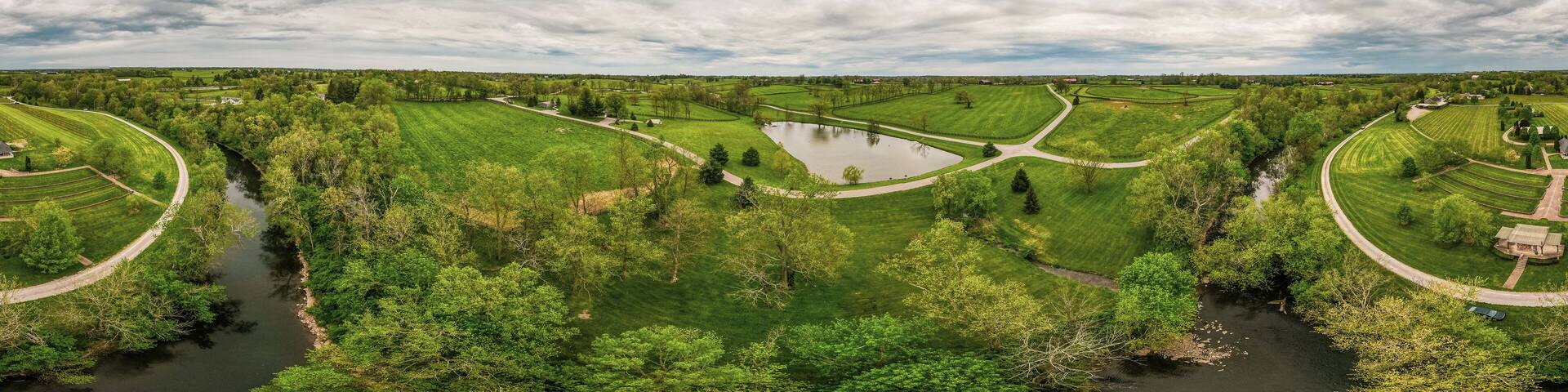 Aerial panorama of horse farms and fields close to the city of Midway, Kentucky