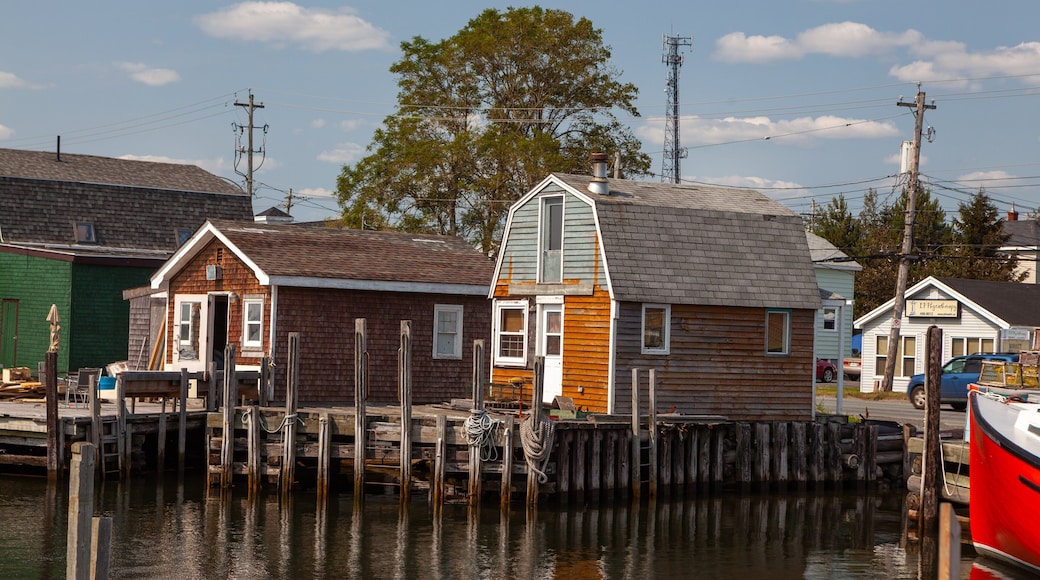 Fisherman\'s Cove which includes a house and a bay or harbour