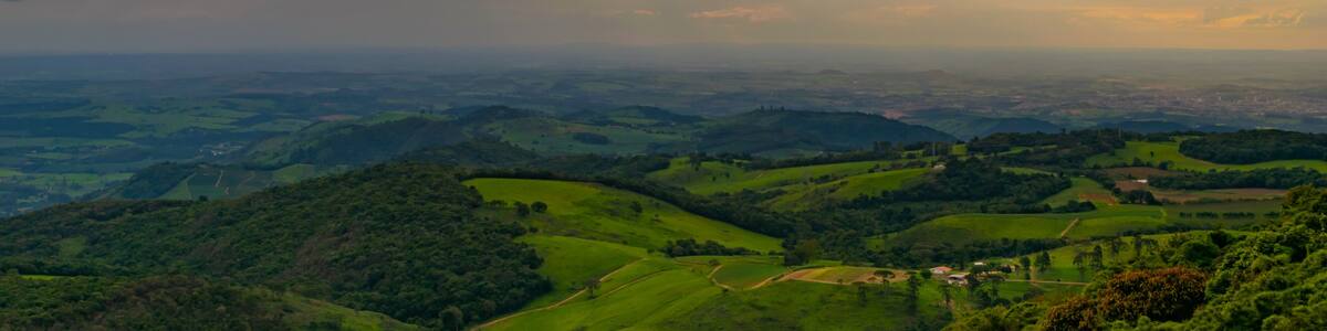 Sun between the clouds, at dusk at Pico do Gavião. Andradas. Brazil