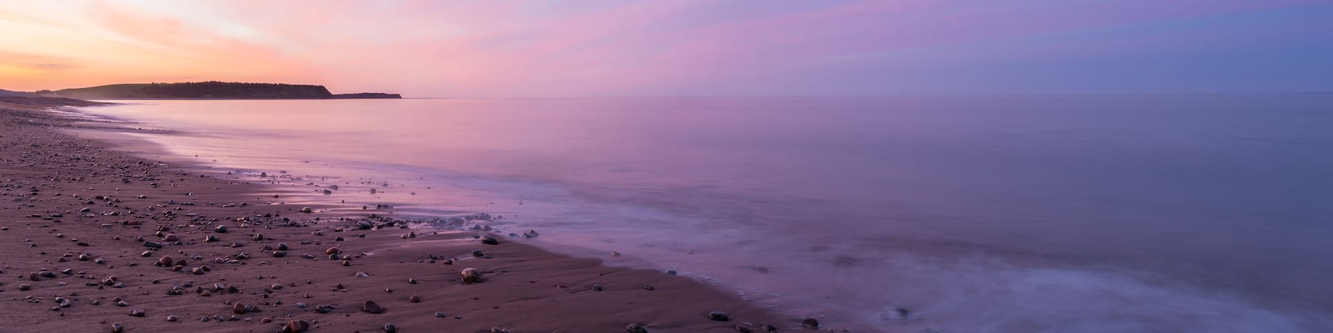 Panorama of ocean beach at the crack of dawn