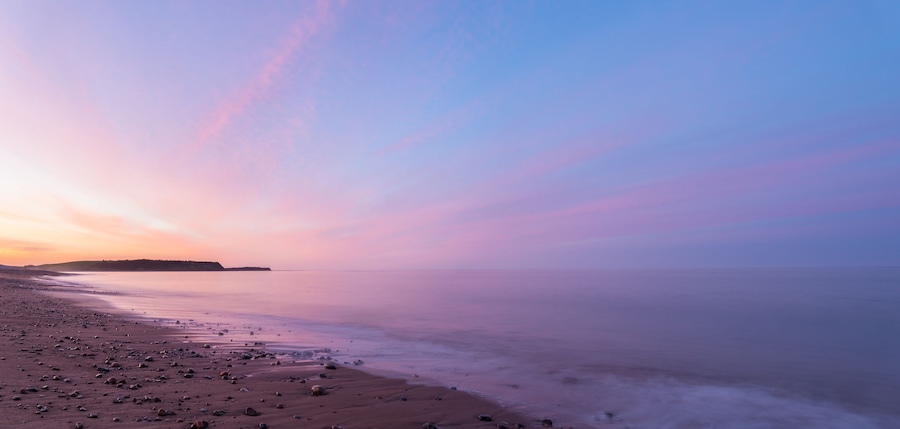 Panorama of ocean beach at the crack of dawn