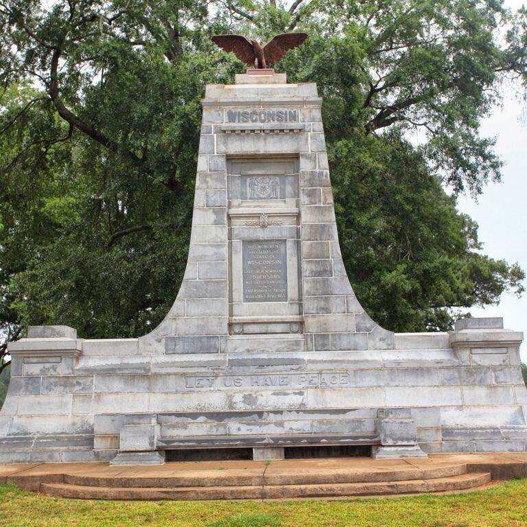 Authorized in 1903 and dedicated on 17 October 1907, the Wisconsin monument is located at the northwest corner of the stockade and more or less dominates the prison site landscape.

It is constructed of Georgia granite, the top being surmounted by a large American eagle cast in bronze.