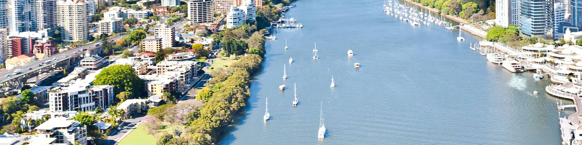 Modern cityscape and a blue water river in the middle