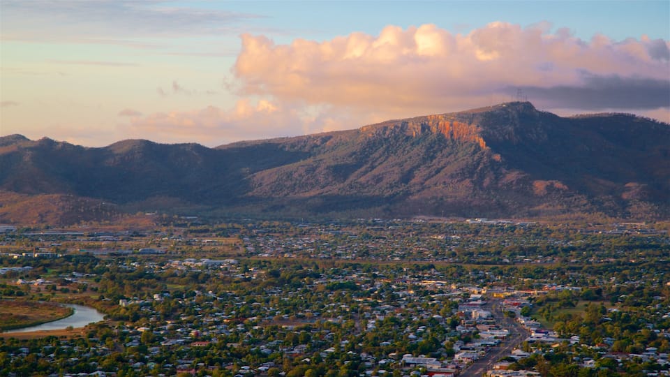 Mount Stuart showing a small town or village, a sunset and mountains